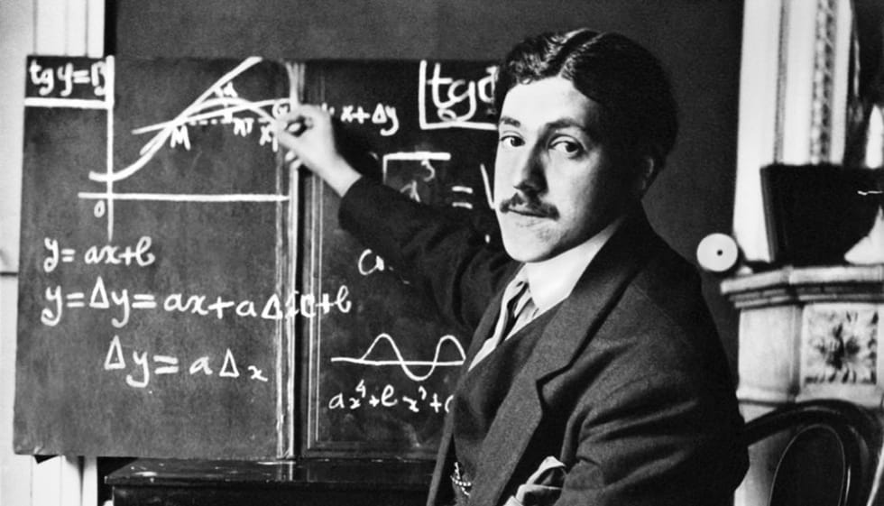 Marcel Bloch in front of a balck board, doing algebra (1912-1913).
